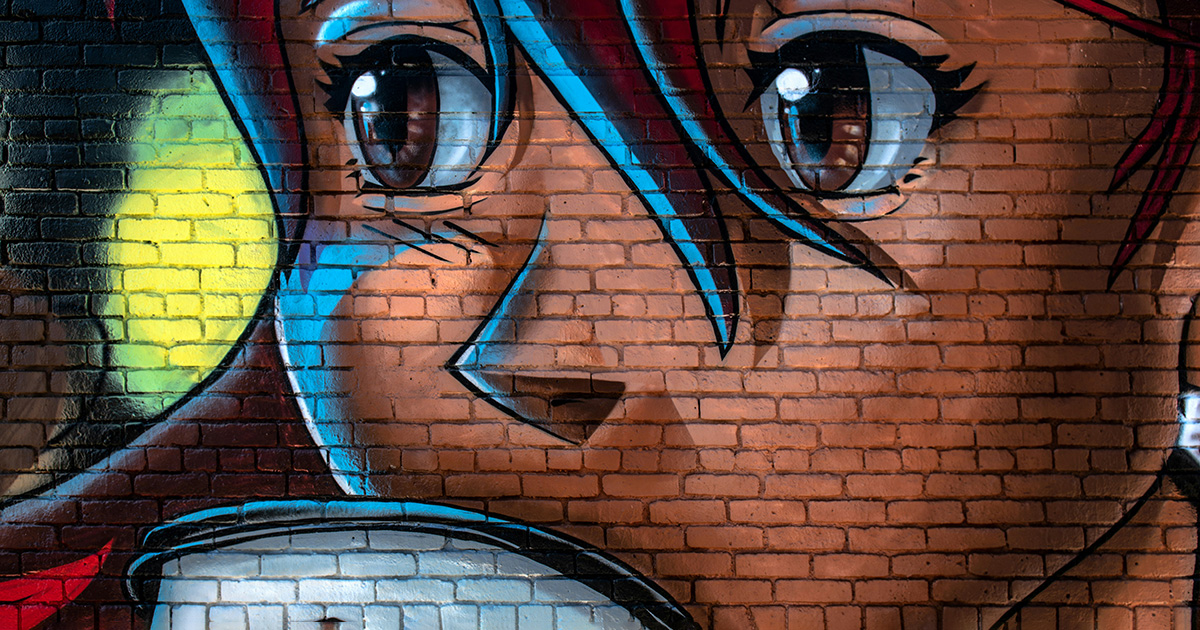 Mural of an anime girl sipping a cup of coffee painted on a brick wall. Anime can inspire students with these college success quotes.