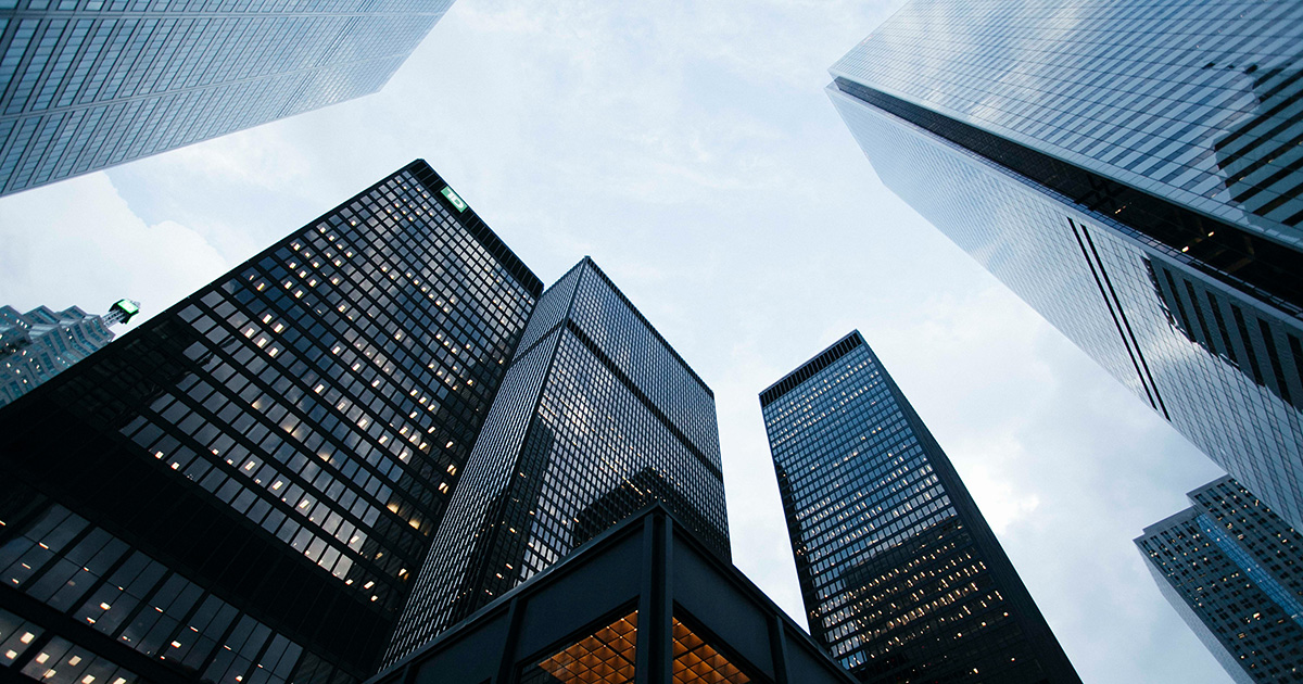 Looking up at five tall black buildings, evoking thoughts of EFSC business degree options.