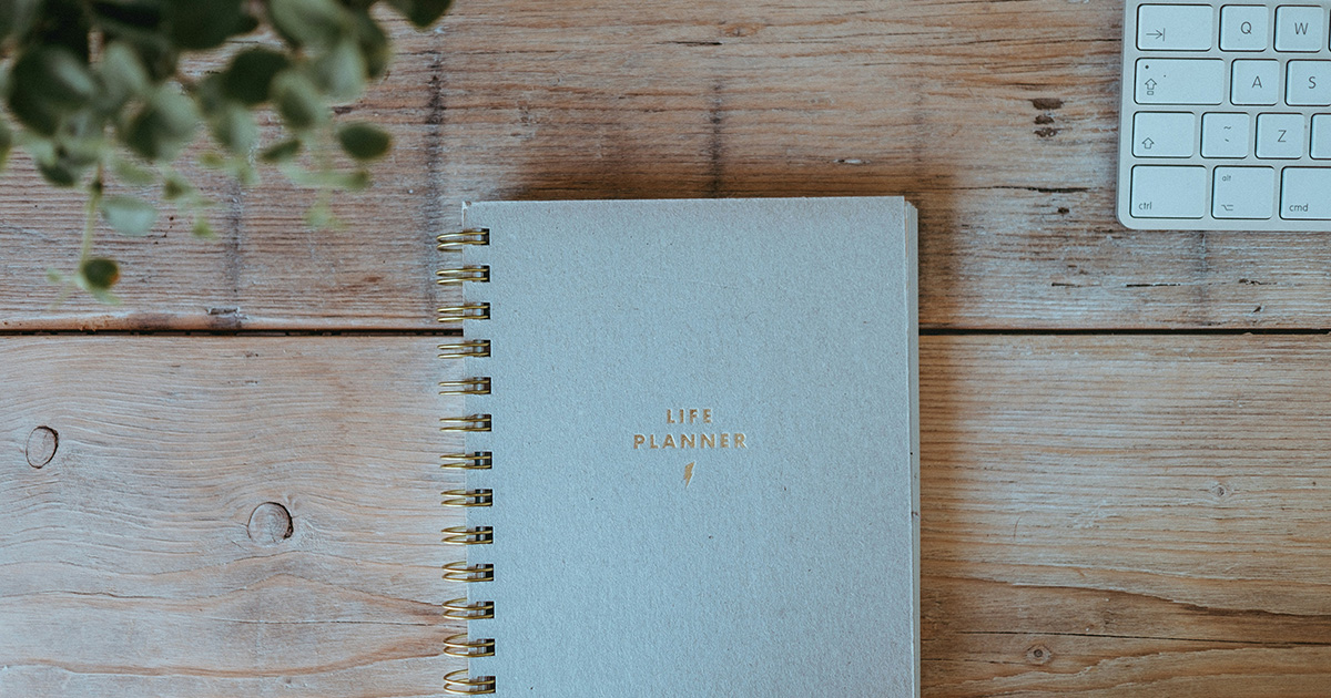 A notebook with "life planner" written on the cover. it brings to mind Success Strategies for College.