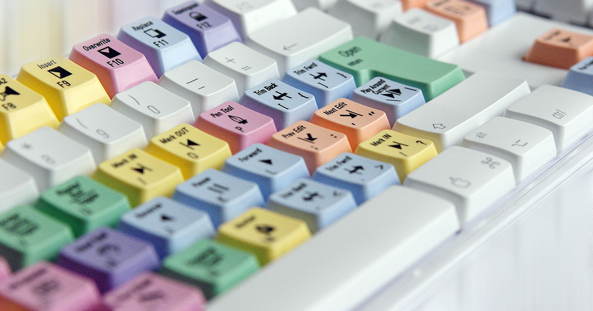 A computer keyboard with keys in multiple colors of the rainbow, perfect for mastering some time management hacks!