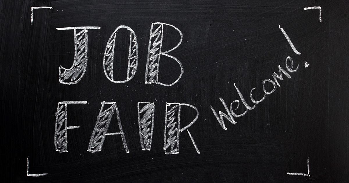Job Fair welcome sign written on a used blackboard. Students can take advantage of tips for job fair success.