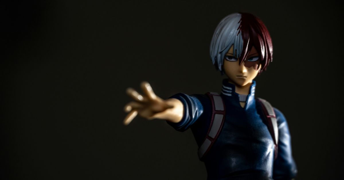 A waist-up, shadowed shot of an anime figure, Todoroki from My Hero Academia, which is one of the shows featured in EFSC's list of Anime to Watch in College.