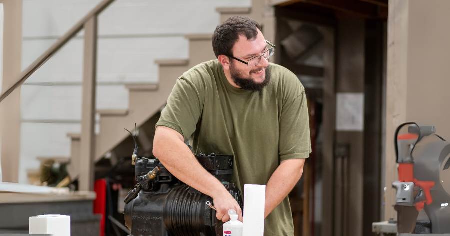 Student working on HVAC equipment