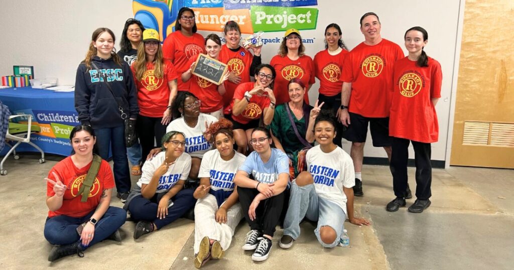 Group of service-learning and Rotaract students standing together for a picture