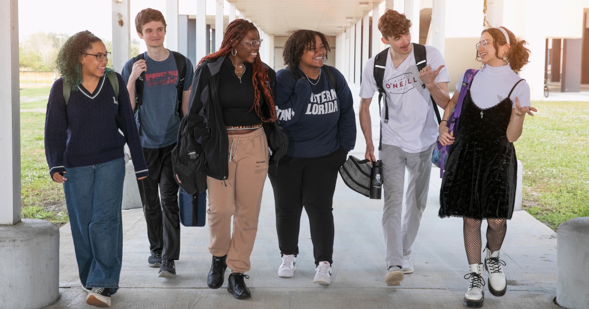 A group of students walking together, practicing a college student micro-habit for healthy living